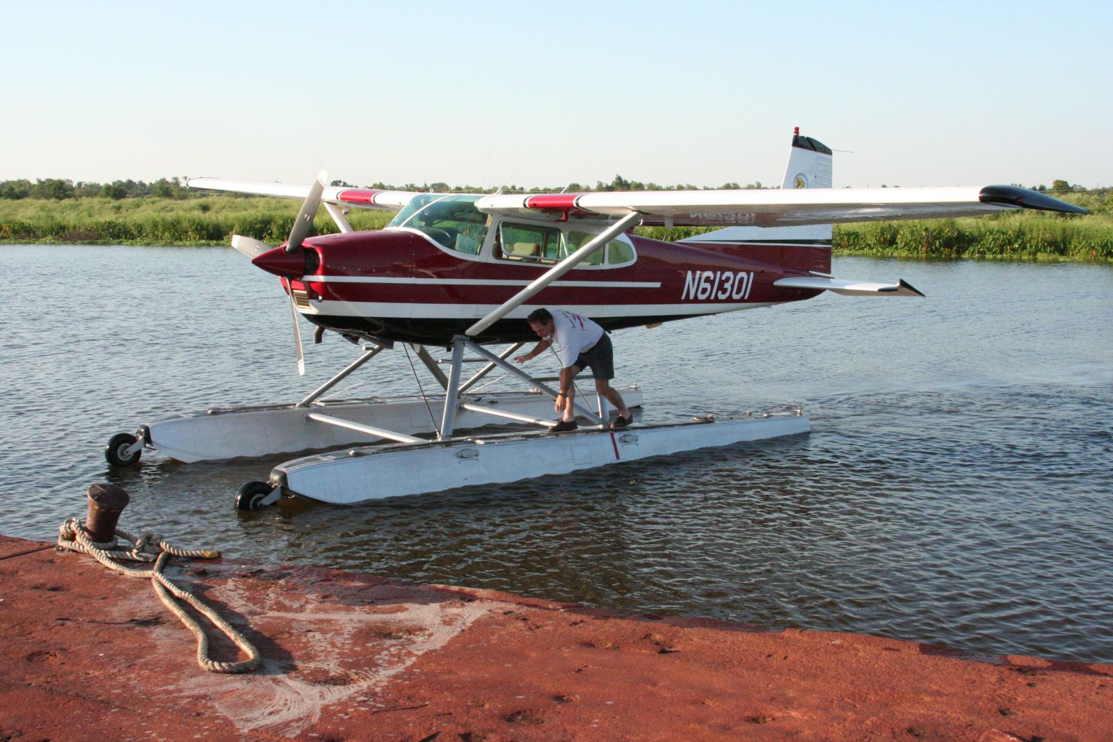 Picture of a pilot docking a seaplane.